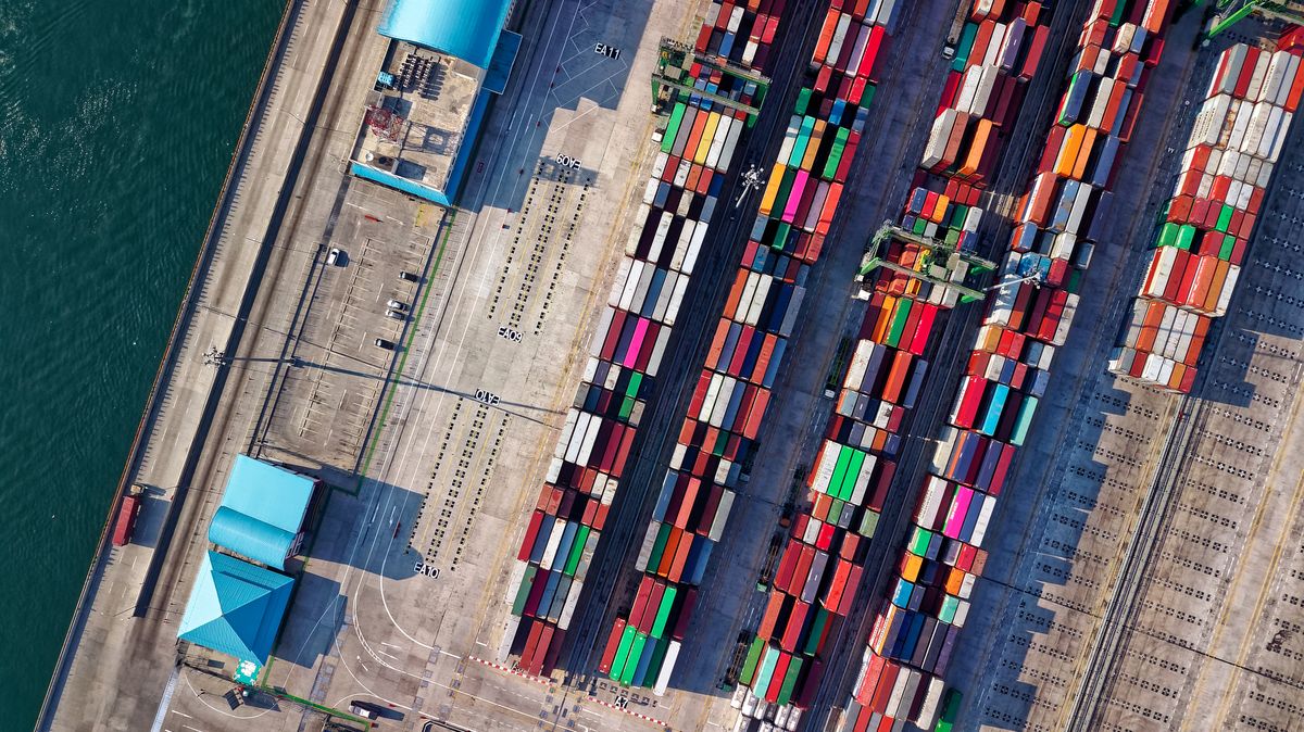 Container port with shipping vessels representing global vape supply chain logistics in 2026